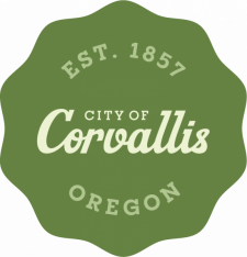 Decorative green medallion with the City of Corvallis logo
