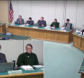 A scene during a Corvallis City Council meeting with the Mayor and City Council sitting at the dais.