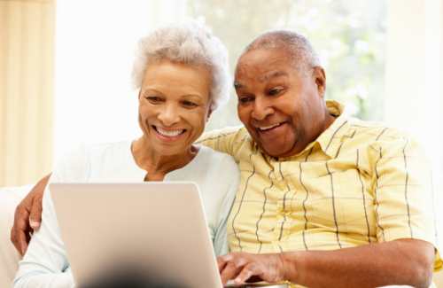 Senior couple using computer