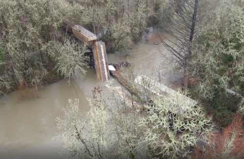 Marys River Train Trestle Overhead photo of Marys River with collapsed train trestle and several derailed train cars