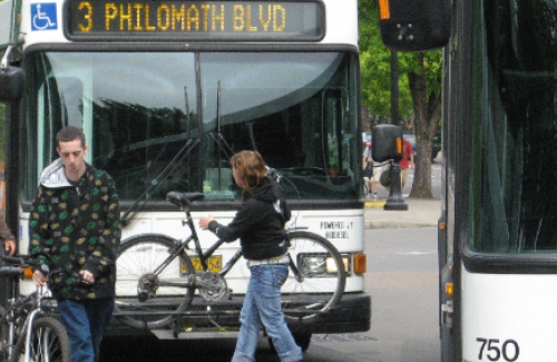 Bikes on buses Passenger loading a bike onto the front rack of a CTS city bus.