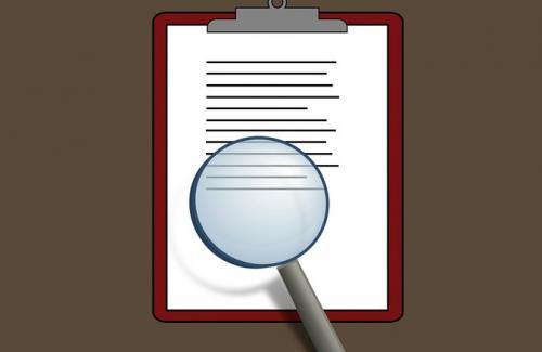 Magnifying Glass on Clipboard Graphic