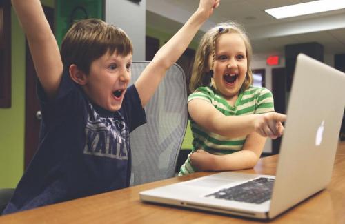 Excited children looking through Parks & Rec classes online