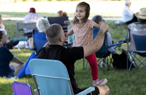 child dancing in park