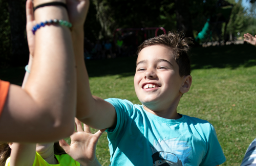 kids running in park, high five