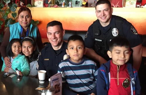 Corvallis police with a group of community members at a restaurant