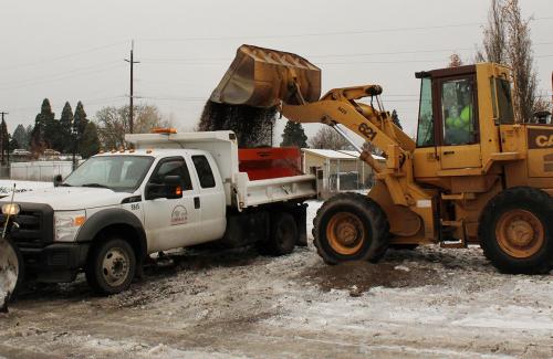 Loading sand into plow truck