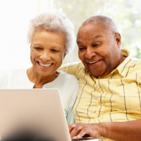 Senior couple using computer