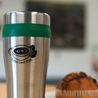 Coffee Leaf Cafe cup at table