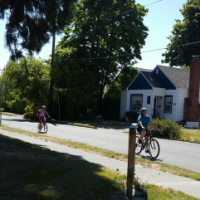 bicyclists ride around the Jobs Addition Neighborhood.