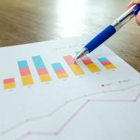 Image of pen pointing at a Chart