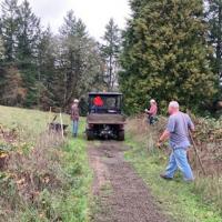 Neighbors spread gravel at Woodland Park.