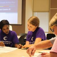 People having a discussion at a city meeting