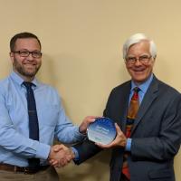 Patrick accepting the Silver Circle award from the Corvallis mayor