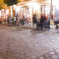 Cafe tables and chairs outside on the sidewalk