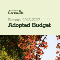 City of Corvallis Biennial 2025-2027 Adopted Budget showing red autumn leaves against a blue sky with trees in the background