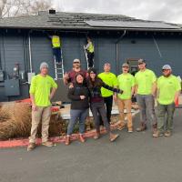 Construction workers in bright yellow shirts standing outside the Corvallis Community Center
