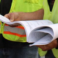 Workers looking at construction plans