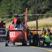 Emergency medical service staff with helicopter
