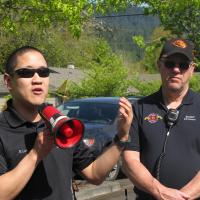 Corvallis and Benton County emergency managers speaking through a megaphone during an evacuation drill.