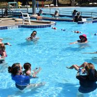 Summer WaterBabies class in outdoor pool
