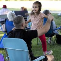 child dancing in park
