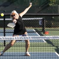 woman playing pickleball photo by amanda loman