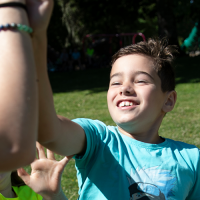 kids running in park, high five