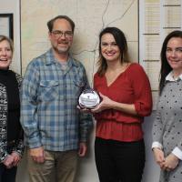 Celeste Krueger presents the Blue Sky Legacy Award to City of Corvallis staff.