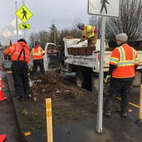 City staff working on a pedestrian crossing