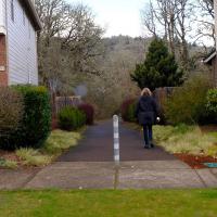 Woman walking down an active travel corridor in Corvallis