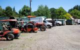 Parks maintenance vehicles stored outdoors exposed to the elements