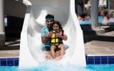 Dad and daughter on slide