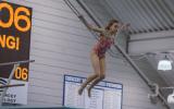 Girl jumping from diving board