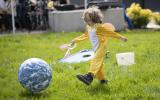 Kid with large earth ball