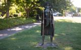 statue racoon crocodile woman art