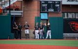 Two officers stand with Corvallis Knights baseball players