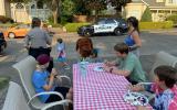 McGruff the crime dog and children at national night out eating at a picnic table