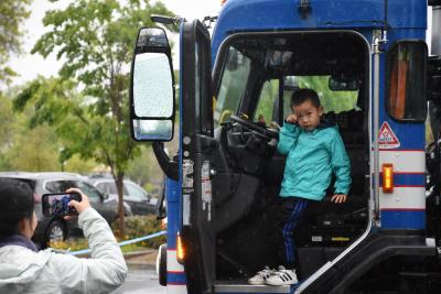 Boy in a large truck. 