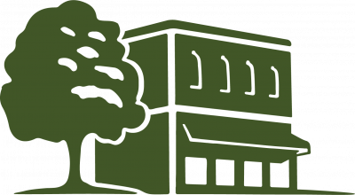image of storefront building with oak tree to the side