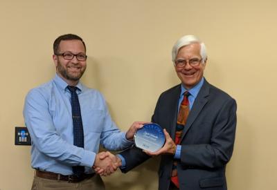 Patrick accepting the Silver Circle award from the Corvallis mayor