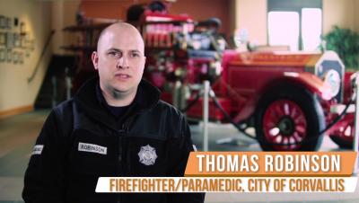 Corvallis firefighter being interviewed on TV