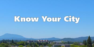 Know your city white text on blue sky background