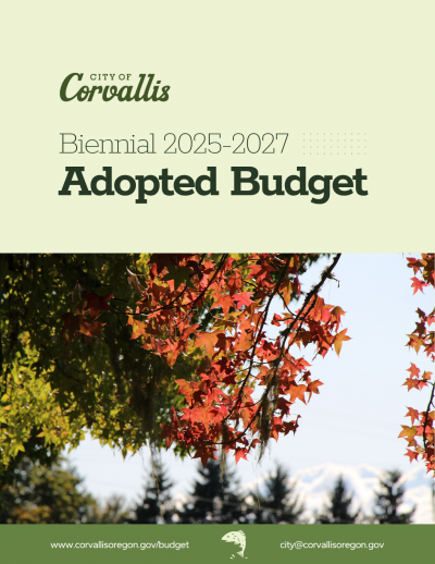 City of Corvallis Biennial 2025-2027 Adopted Budget showing red autumn leaves against a blue sky with trees in the background