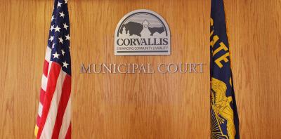 Corvallis Municipal Court logo with American flag and Oregon flag on either side