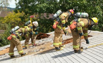 Firefighters training on roof