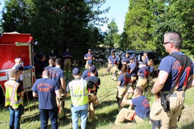 Corvallis Firefighters meeting outdoors before a training exercise.