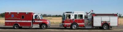 fire truck and a ambulance on the road