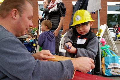 Building inspectors building birdhouses with kids