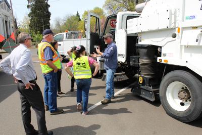 Kids checking out a white dump truck